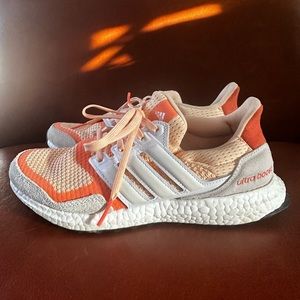 Orange and white Adidas Ultraboost shoes